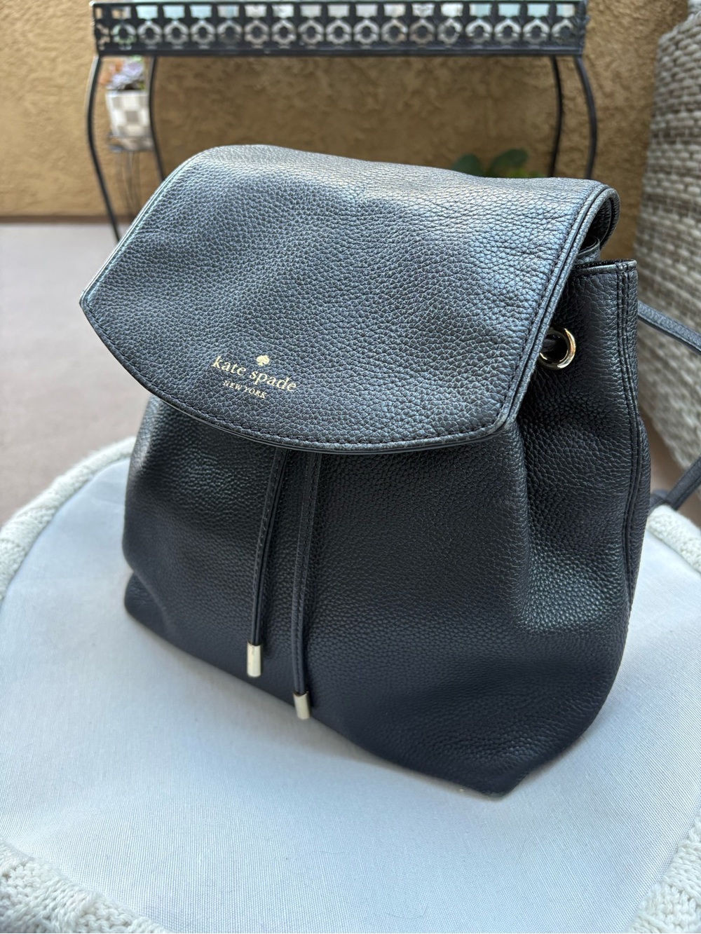 kate spade Black Pebbled Leather Drawstring Flap Backpack
